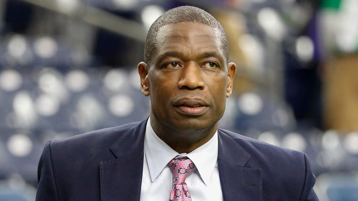 Dikembe Mutombo at an NFL game