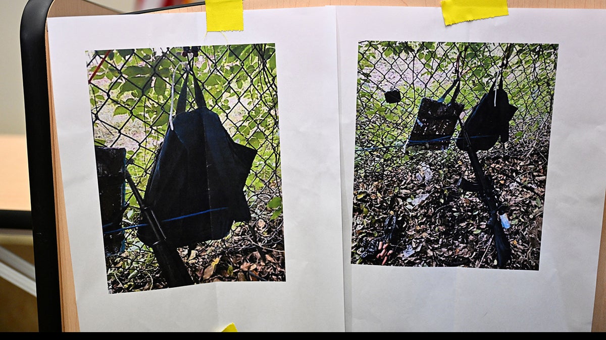 Pictures of evidence found at the fence of former President Donald Trumps golf course are shown at a press conference