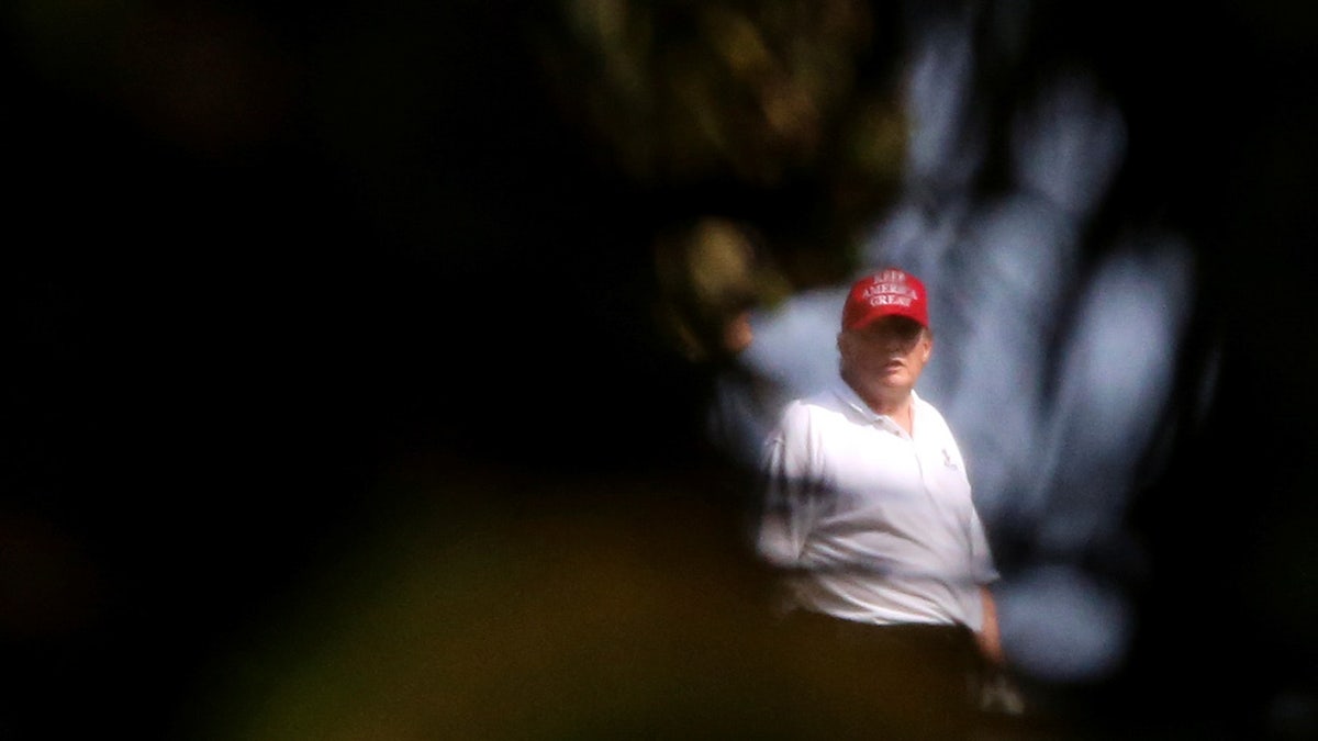 Donald Trump plays golf at Trump International Golf Club in West Palm Beach