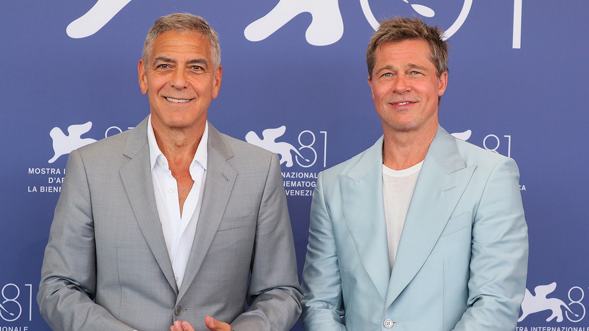 Venice, Italy - September 1: Brad Pitt and George Clooney visit the "Wolves" Photocall during the 81st Venice International Film Festival at Palazzo del Casino on September 1, 2024 in Venice, Italy. (Photo by JB Lacroix/FilmMagic)