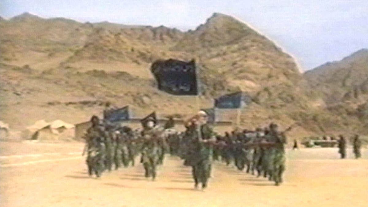 Terrorists participate in military training in this undated still frame from a recruitment video for Usama Bin Laden''s extremist Al Qaeda network.?