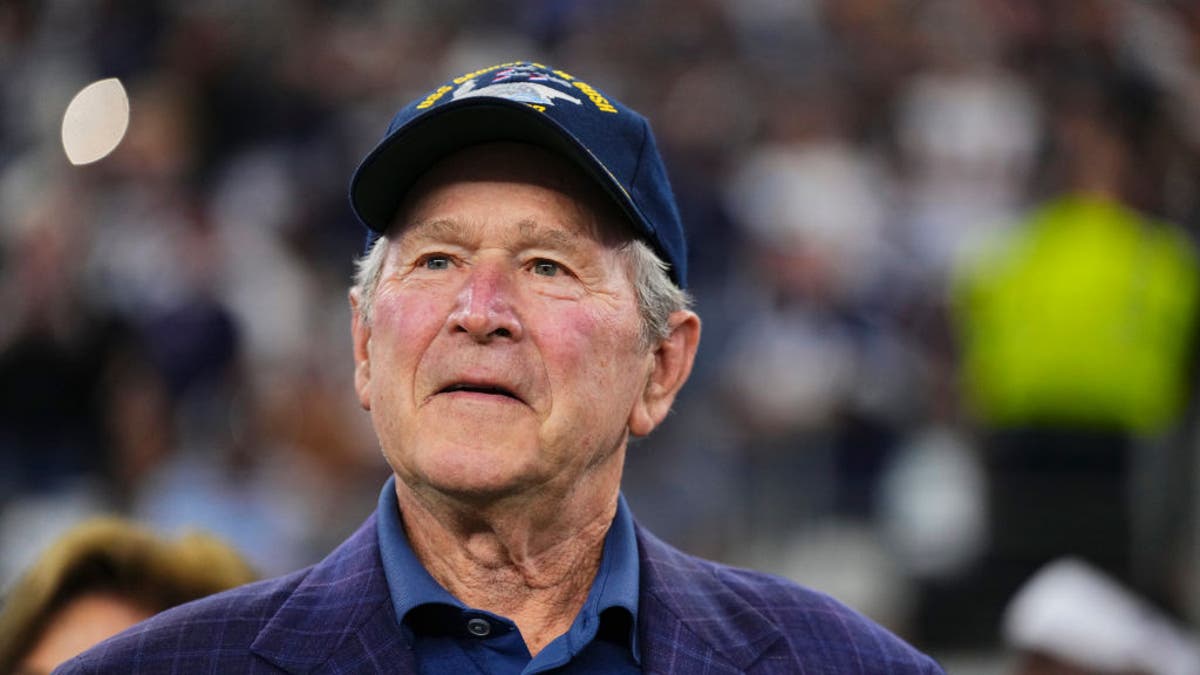 Former U.S. President George W. Bush looks on before kickoff between the Dallas Cowboys and the New York Giants at AT&T Stadium on November 12, 2023 in Arlington, Texas. (Photo by Cooper Neill/Getty Images)