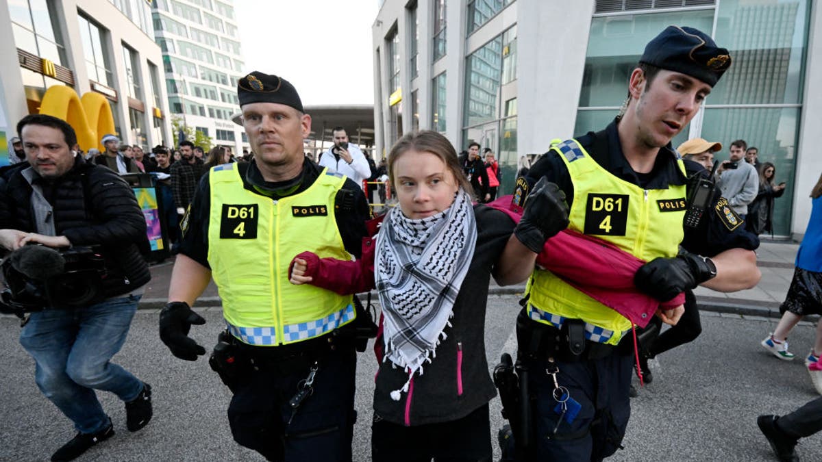 Climate activist Greta Thunberg escorted by police away from Gaza protest