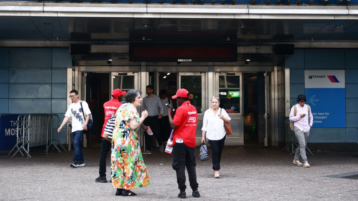 Penn Station seen from outside with some people entering and exiting