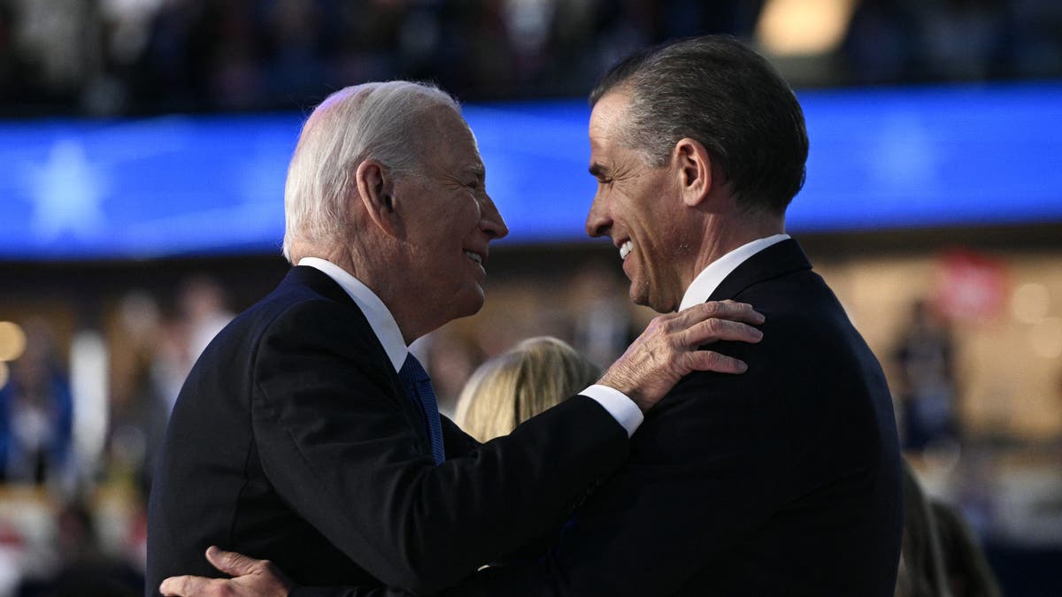 President Biden, left, embraces his son Hunter at the DNC