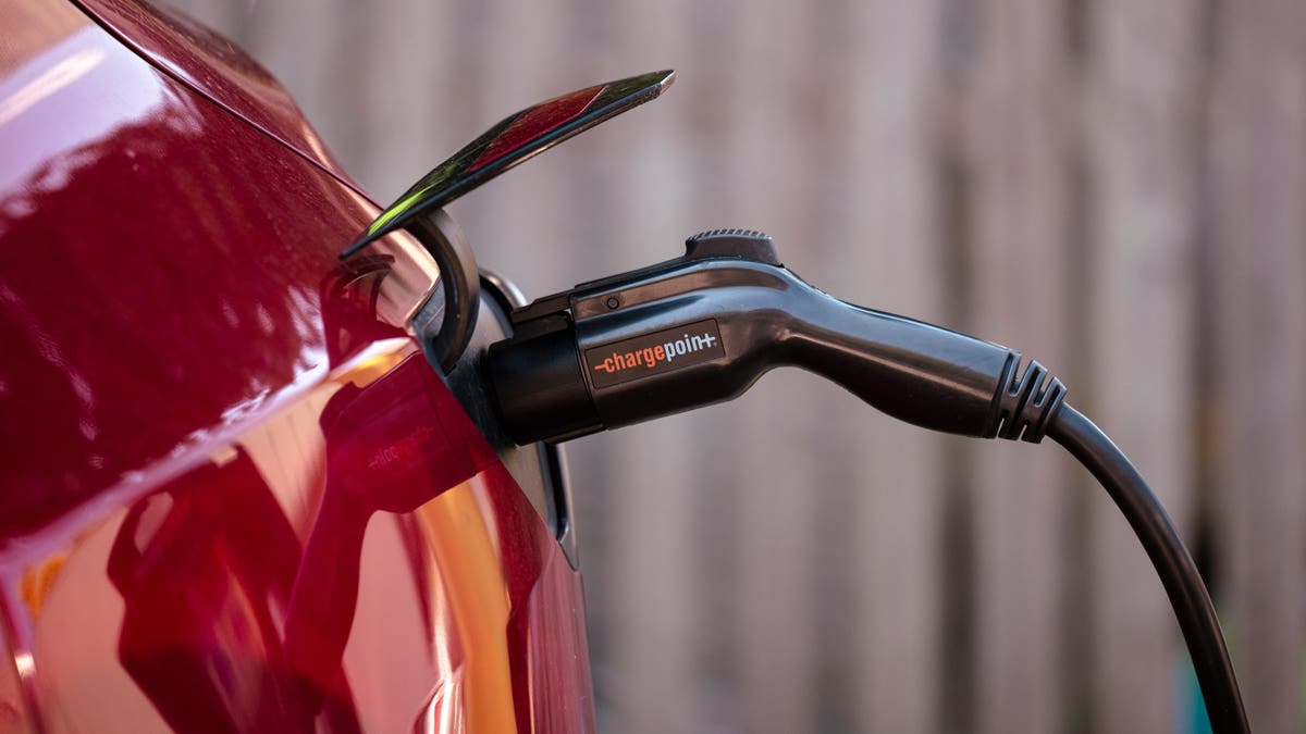 A Tesla charges at an electric vehicle charging station in New York.