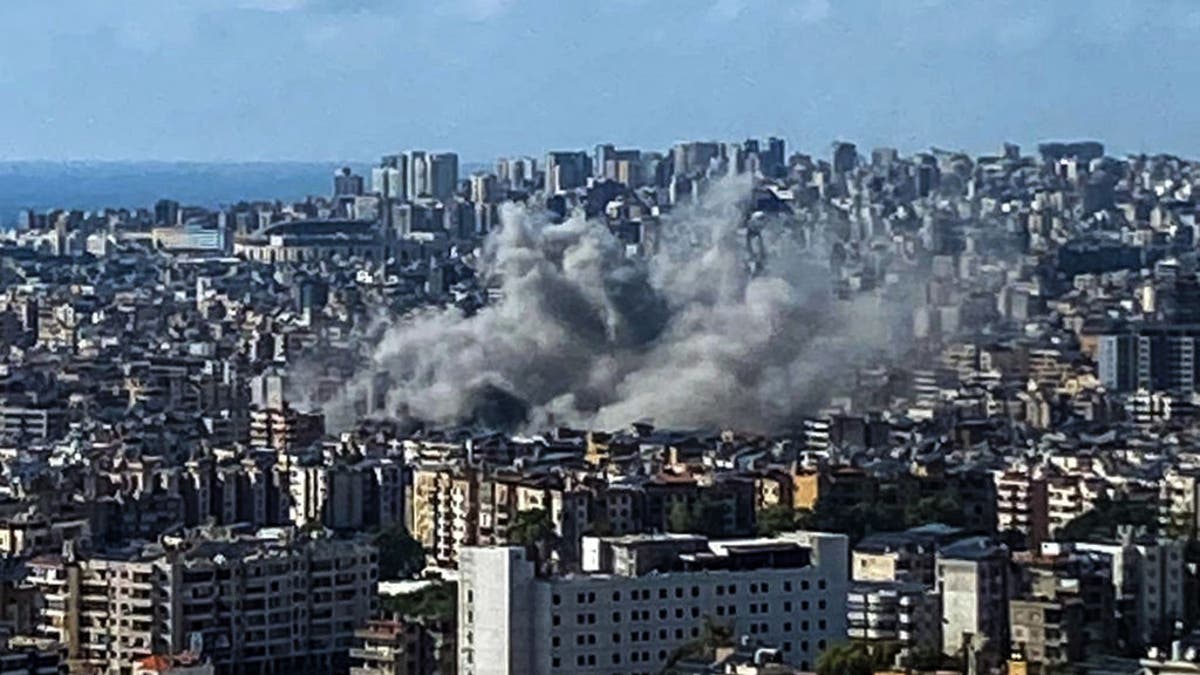 Thick smoke rises above the southern suburbs of Beirut after an Israeli airstrike. Lebanese officials say at least 560 people were killed in Israeli strikes on Monday.