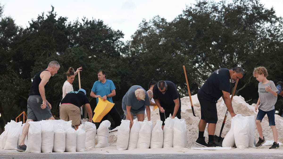 College football team stranded in buses on flooded interstate amid Hurricane Helene destruction  at george magazine