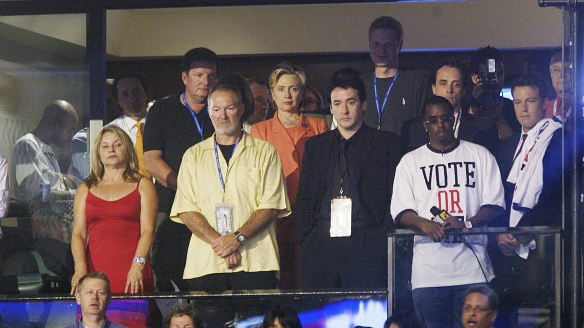 Sean Diddy Combs at right in club box at 2004 DNC