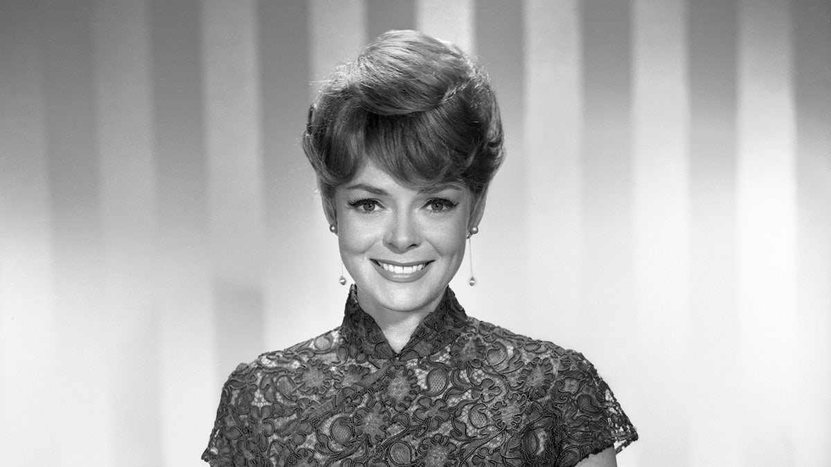 A achromatic  and achromatic  close-up of June Lockhart smiling