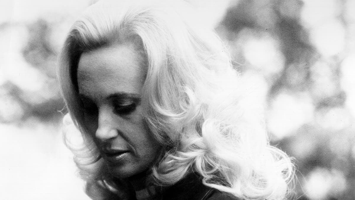 Tammy Wynette looking down.