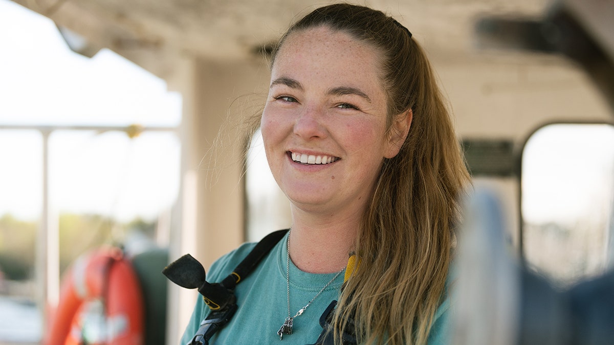 Sadie Samuels smiling on her boat.