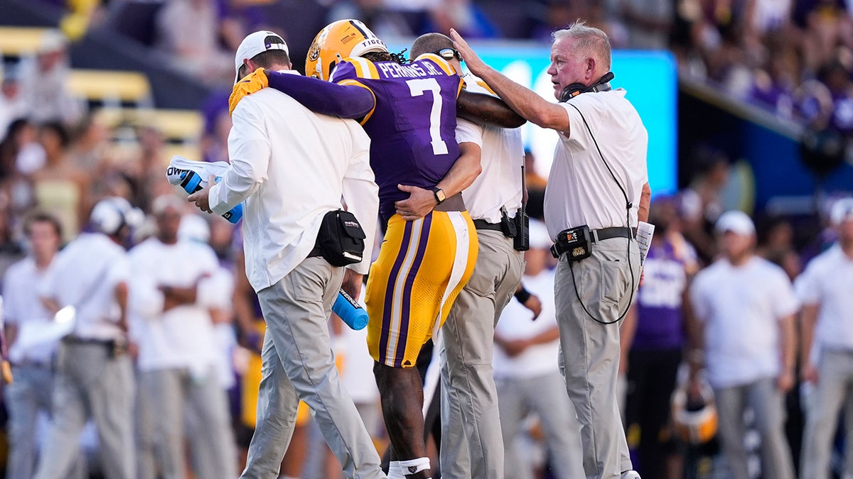 Harold Perkins Jr. helped off the field