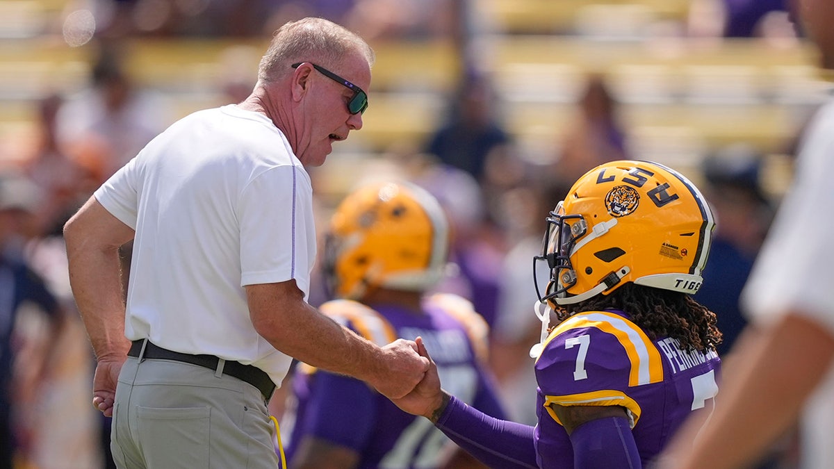 Brian Kelly and Harold Perkins Jr