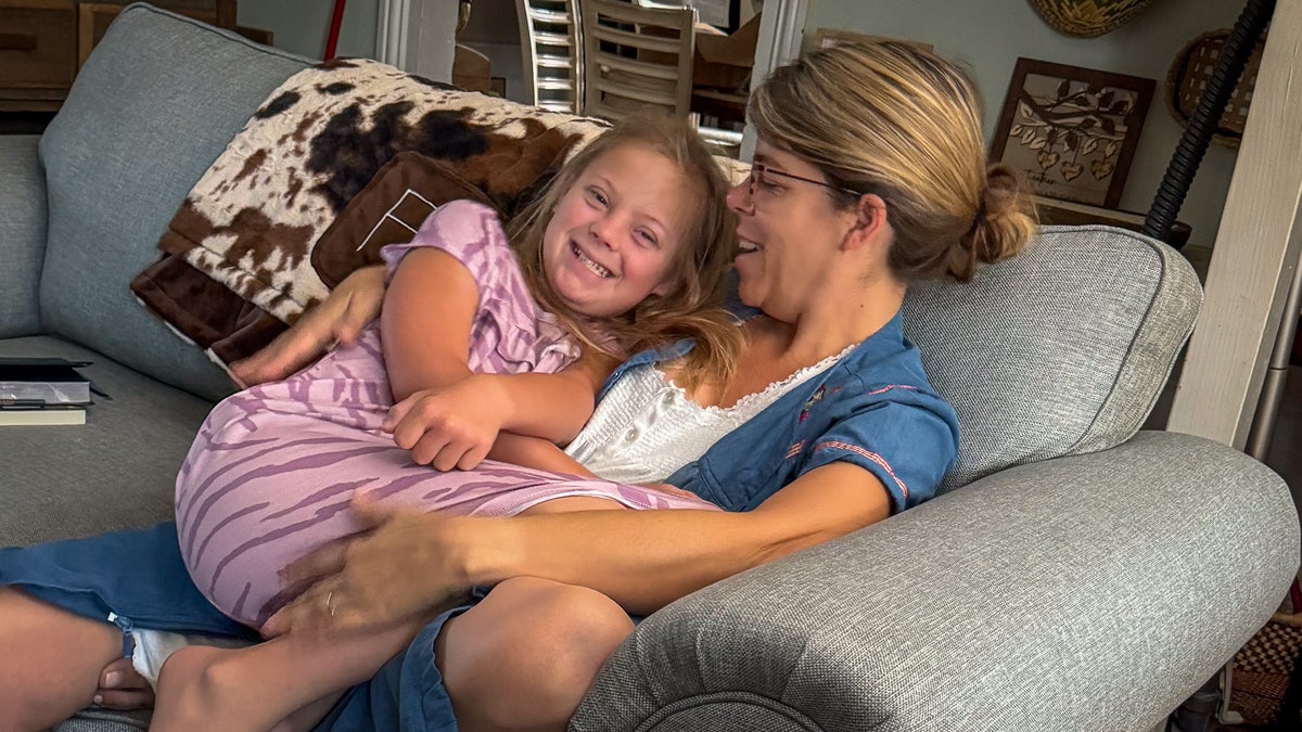 Indiana Feek connected  Rory Feek's woman  Rebecca's lap