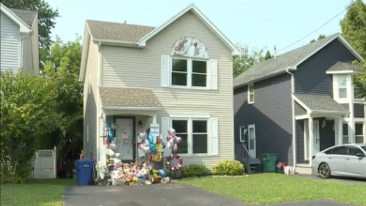 Moreno family home on Knapp Street with vigil