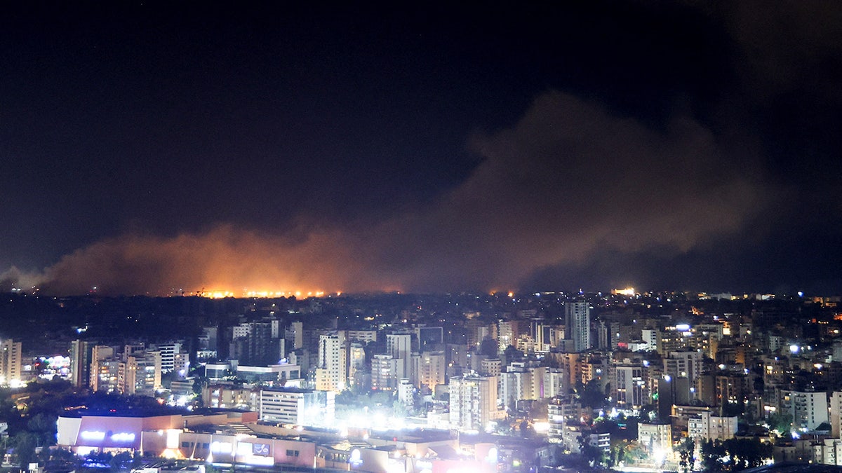 Smoke rises implicit    Beirut's confederate  suburbs aft  a strike