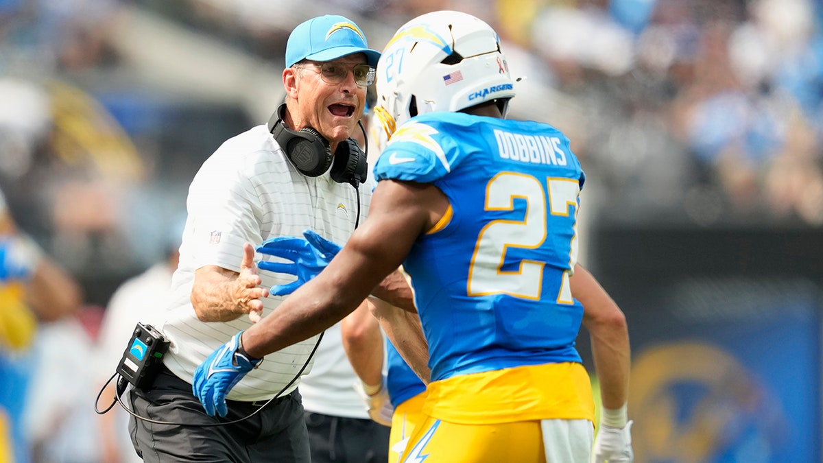 JK Dobbins and Jim Harbaugh