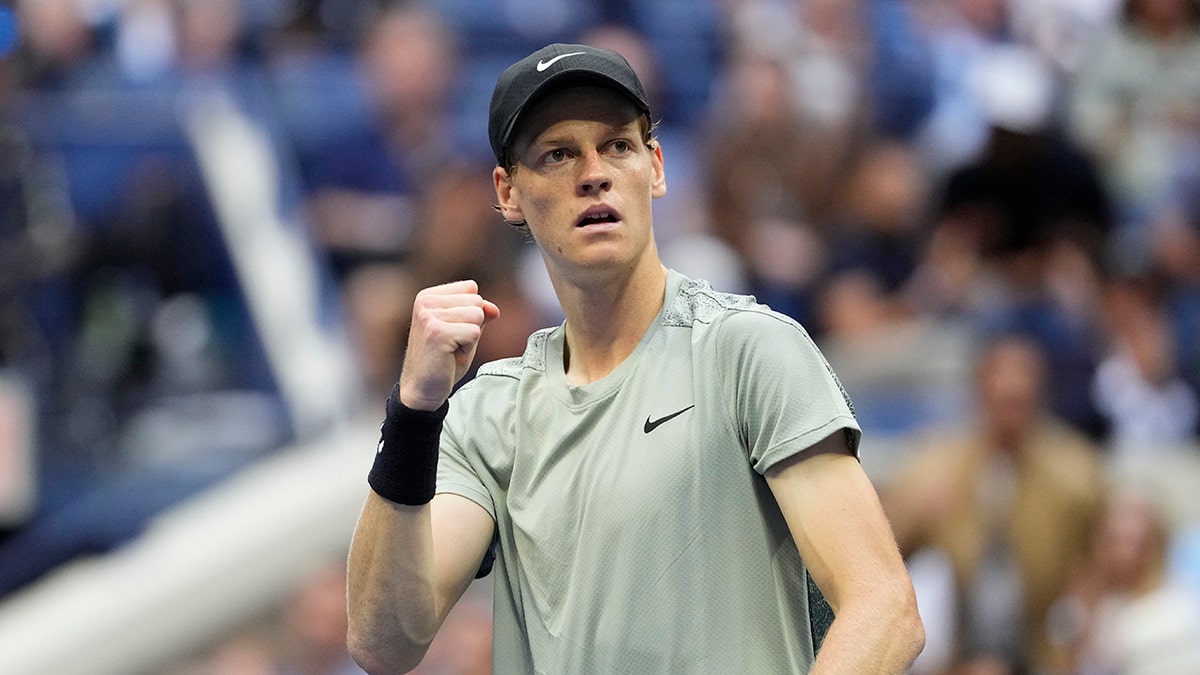 Jannik Sinner reacts during a tennis match