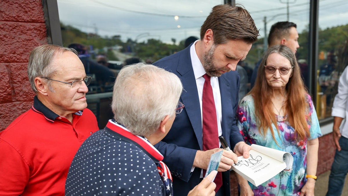 JD Vance greets his supporters