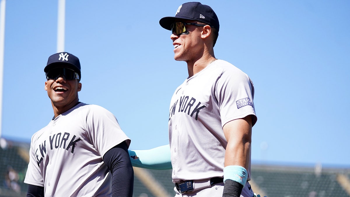 Juan Soto and Aaron Judge look on field