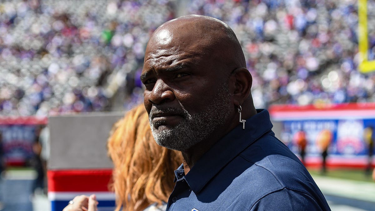 Lawrence Taylor looks at the field