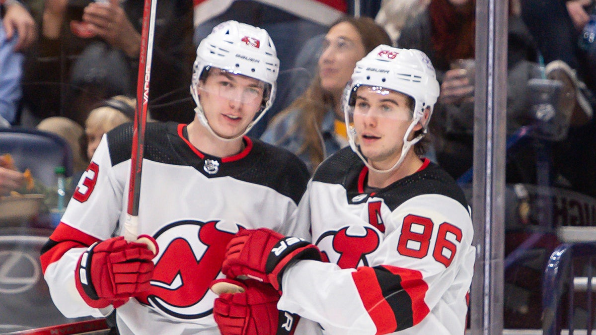 Luke Hughes and Jack Hughes react