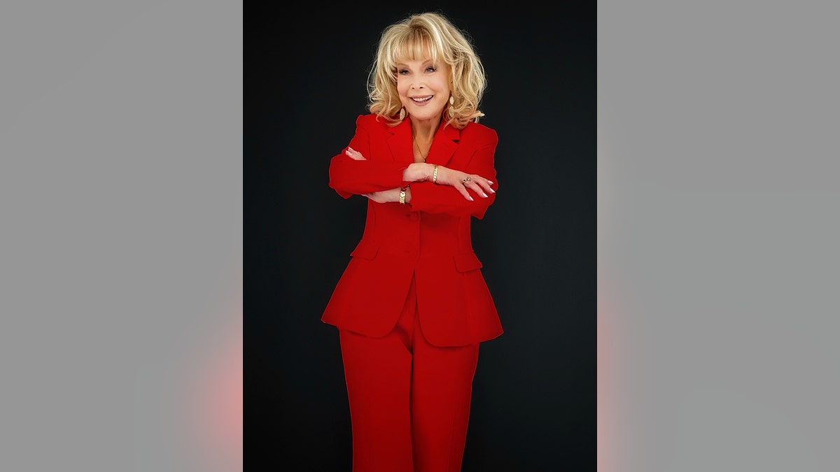 Barbara Eden wearing an all-red suit