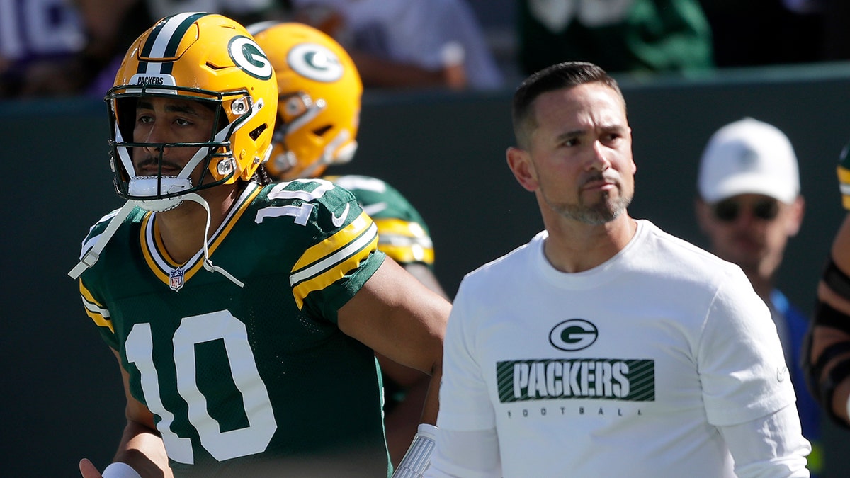 Matt LaFleur walks on field