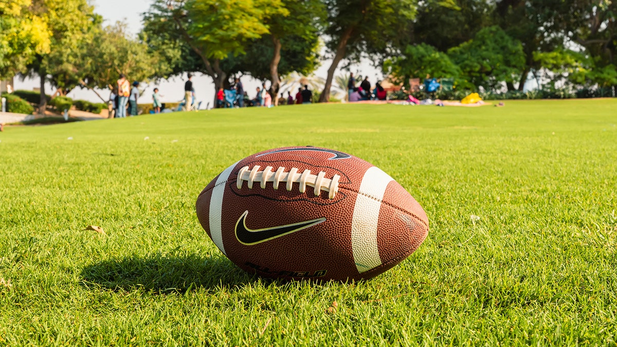 football on ground at NFL tailgate event