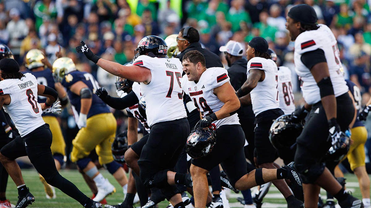 Northern Illinois football players celebrate