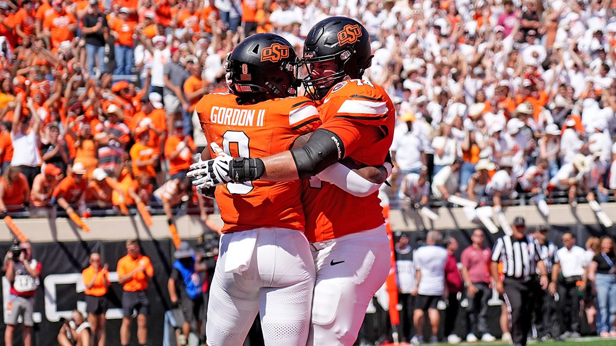 Ollie Gordon II celebrates with Preston Wilson