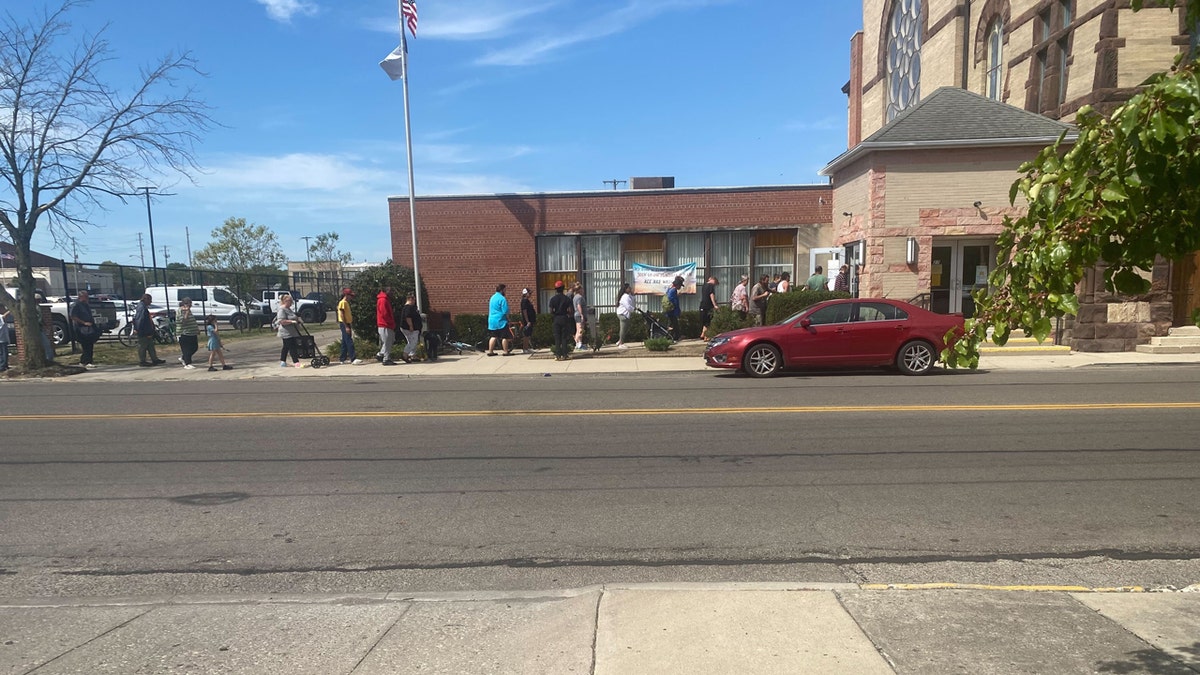 People line up outside a food pantry at St. John's Lutheran Church in Springfield, Ohio.