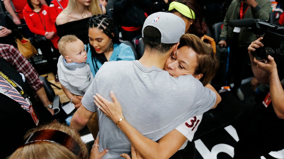 Stephen Curry of the Golden State Warriors celebrates with mom 