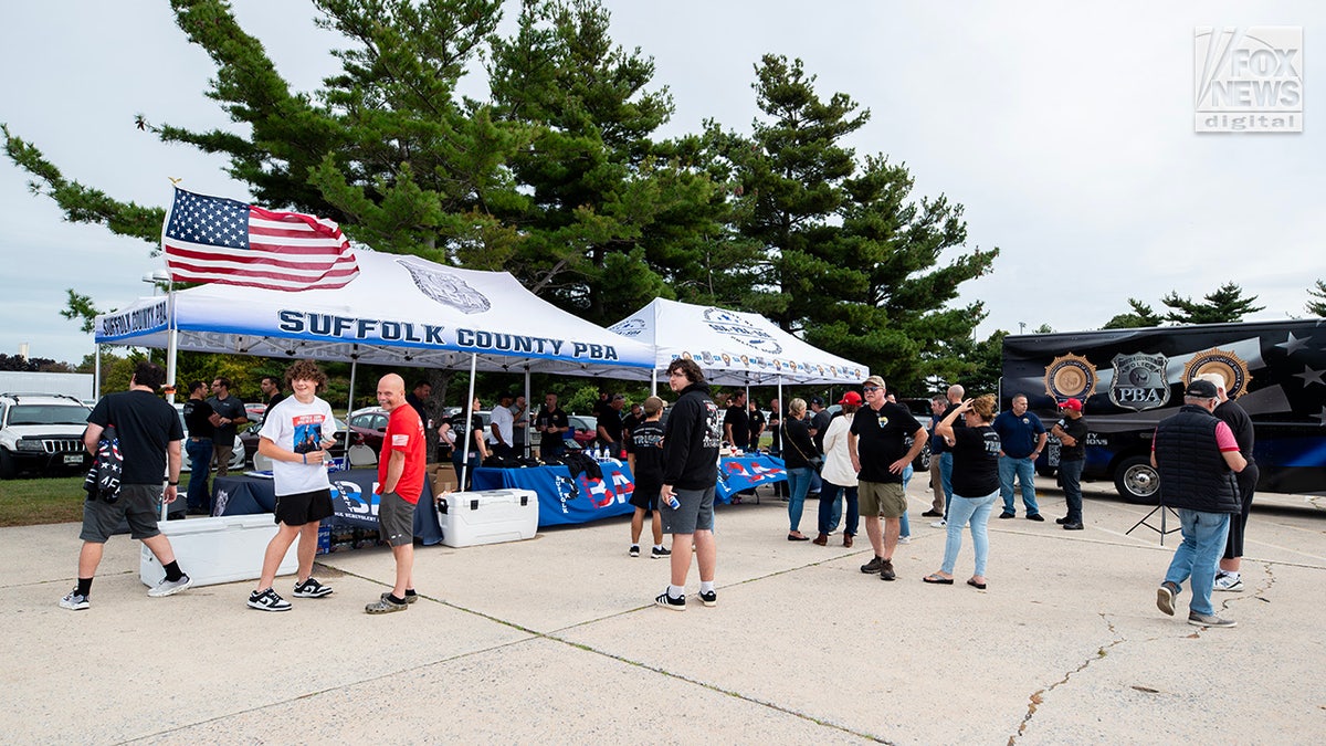 Members of the Suffolk County PBA attend a tailgate party before former President Donald Trump's rally in Uniondale, New York