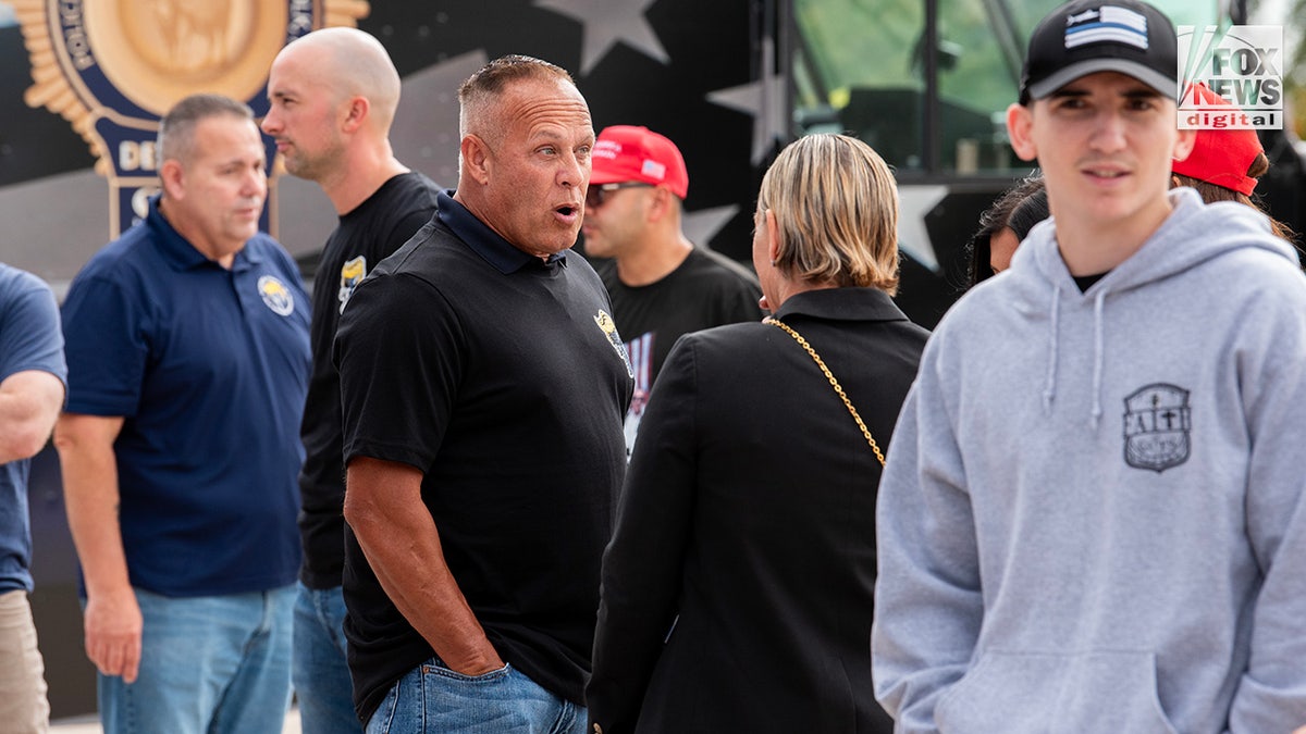 Members of the Suffolk County PBA attend a tailgate party before former President Donald Trump's rally in Uniondale, New York