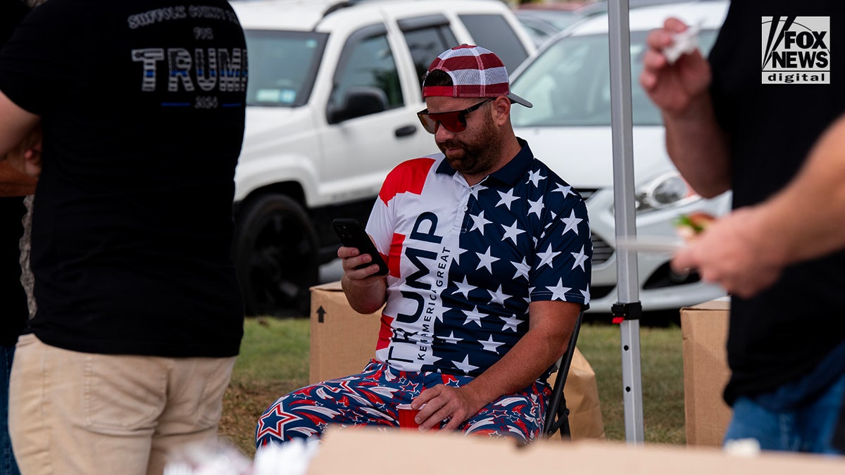 Members of the Suffolk County PBA attend a tailgate ahead of former President Donald Trump’s rally in Uniondale, New York