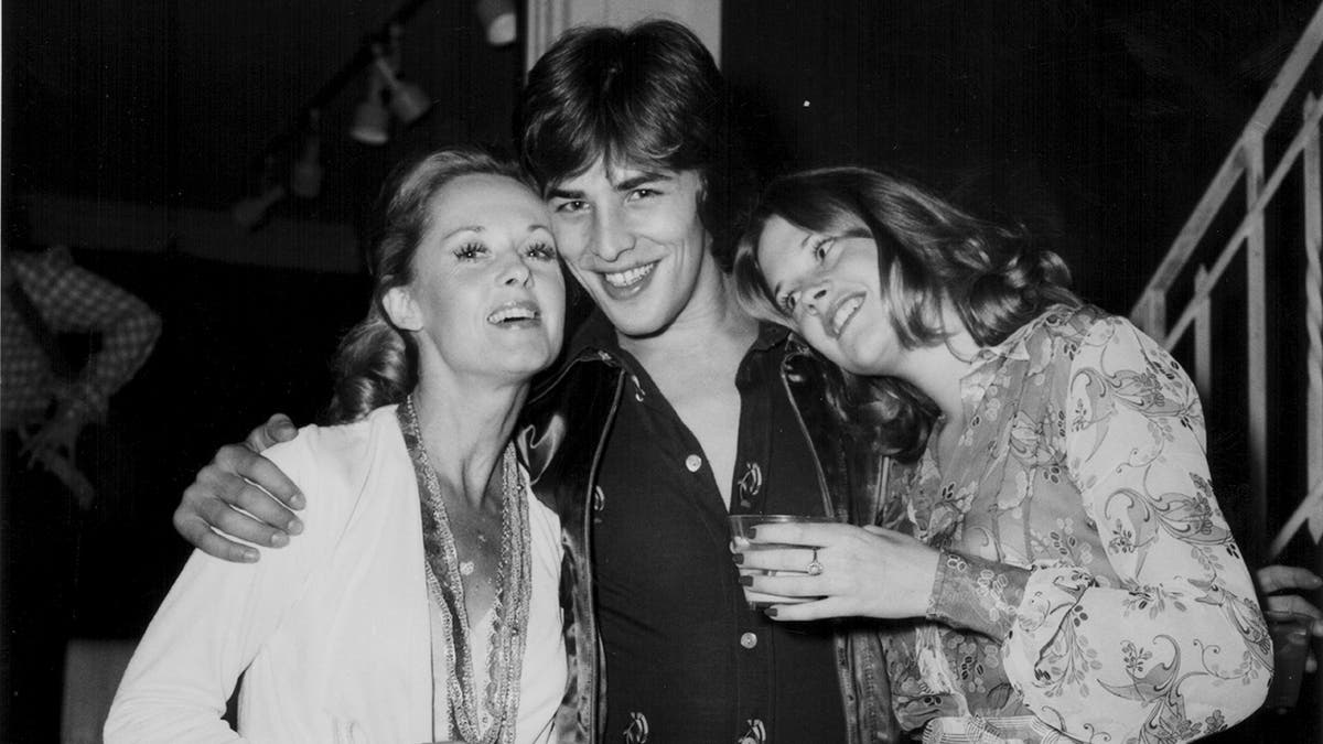 Black and white photo of Tippi Hedren, Don Johnson, and Melanie Griffith