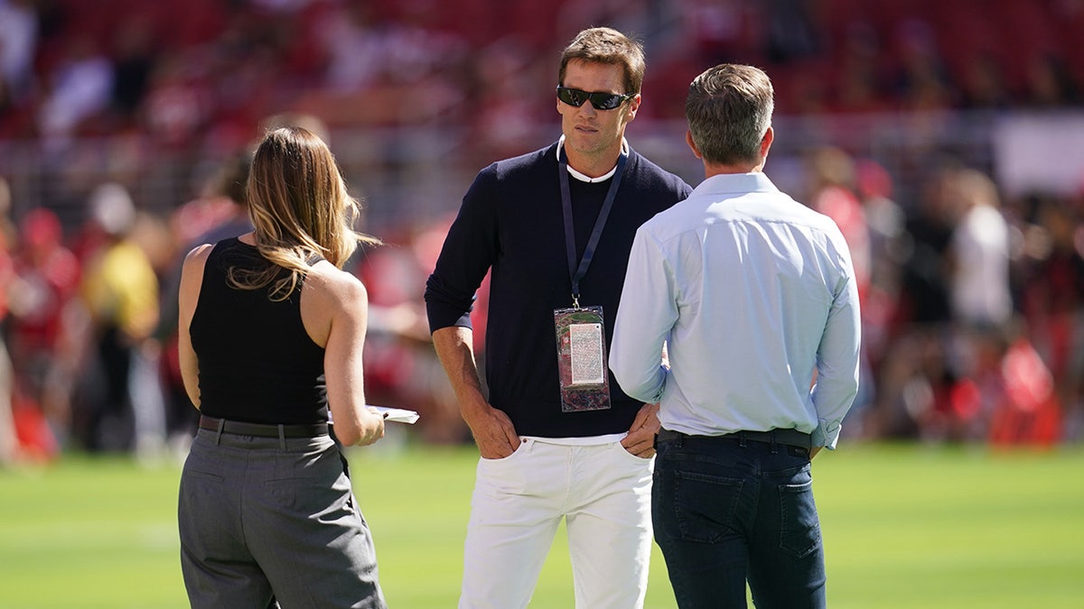 Tom Brady with Erin Andrews and Kevin Burkhardt.