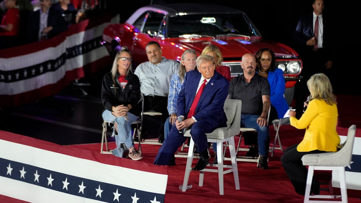 The former Republican presidential president, former President Donald Trump listens to Senator Marsha Blackburn, R-Ten., Right, in a campaign event of the City Council in Macomb Community College, on Friday, September 27, 2024 in Warren, Mich.