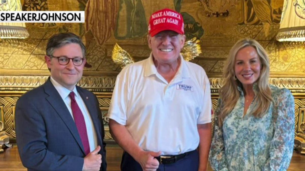 House Speaker Mike Johnson stands with wife Kelly Johnson and former President Donald Trump at Mar-a-Lago.