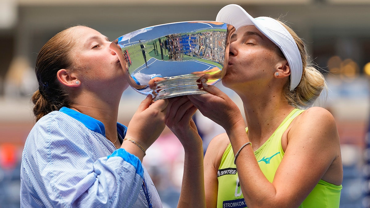 Jelena Ostapenko and Lyudmyla KIchenok celebrate