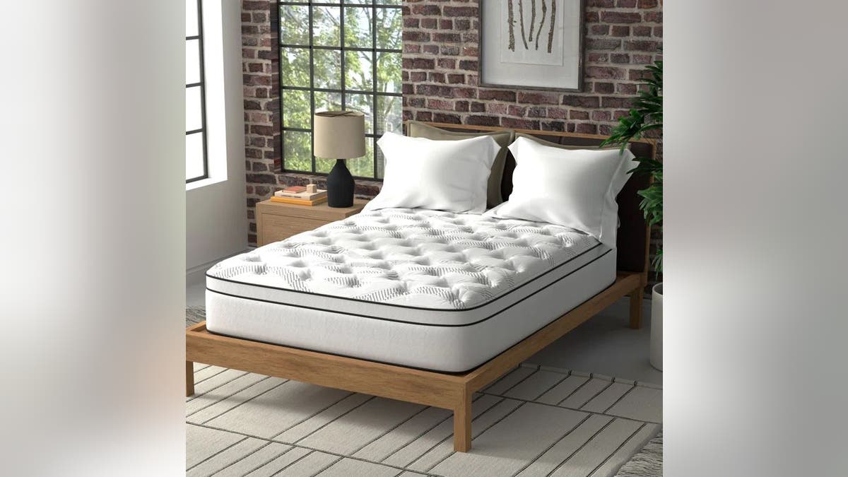 This hybrid representation  foam mattress combines modern   gel representation  foam with classical  pouch  coils.