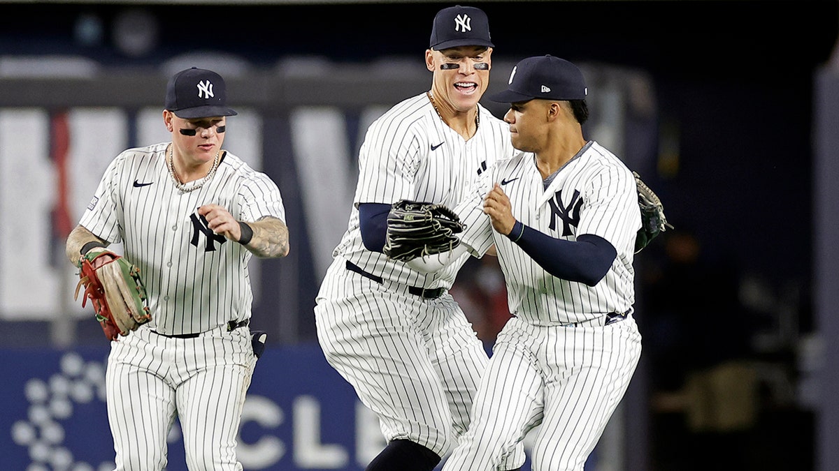 Alex Verdugo, Aaron Judge and Juan Soto celebrate