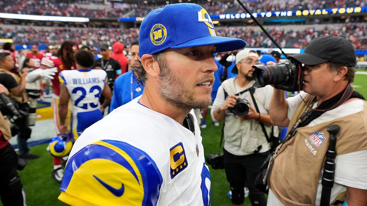 Matthew Stafford is walking out of the stadium