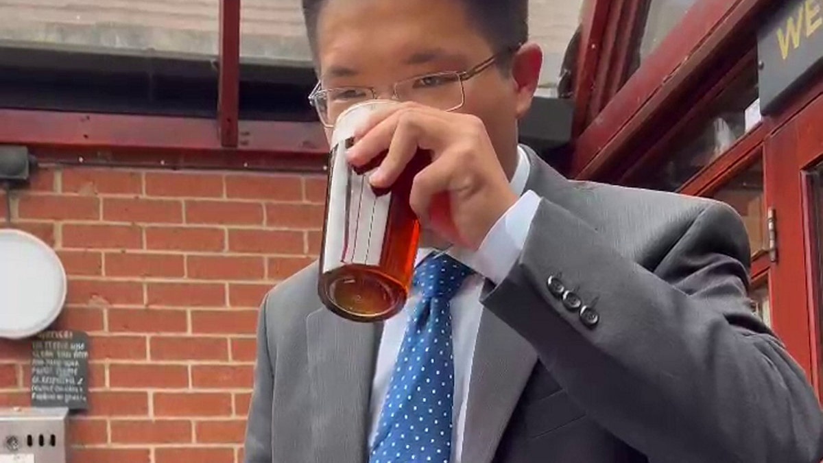 Man drinking beer.