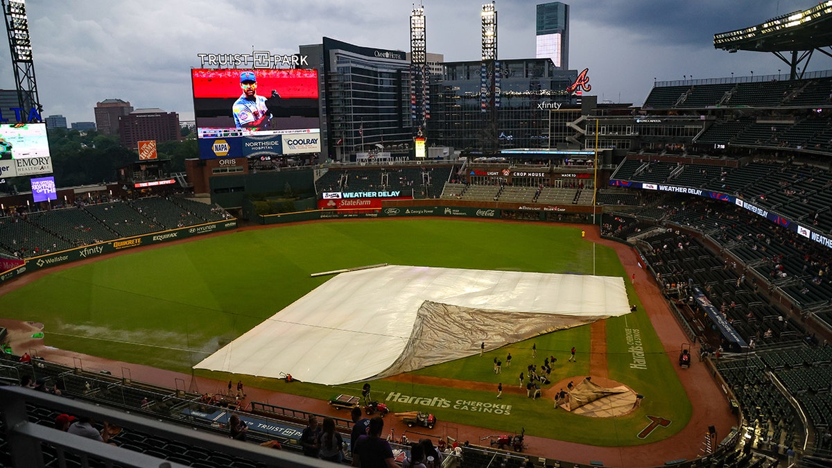 Braves tarp on field