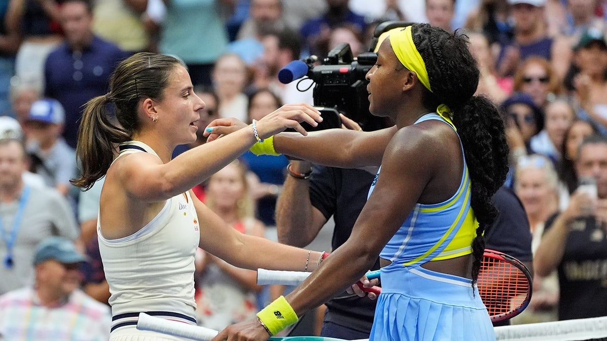 Coco and Emma hugging each other