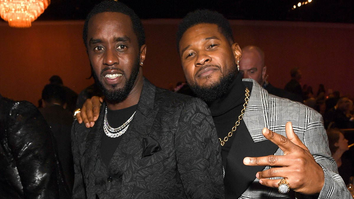 Sean Diddy Combs wore a black suit with Usher in grey.