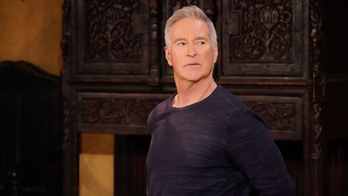 Drake Hogestyn as John Black looks to the left in a serious still "Days of our lives"